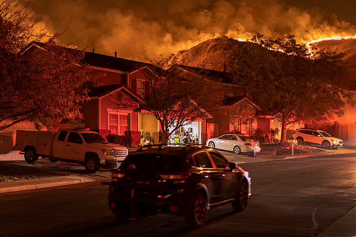 Flames come close to houses during the Blue Ridge Fire on October 27, 2020 in Chino Hills, California.