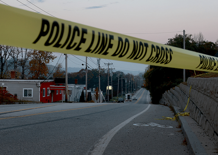 Police line tape in Lewiston, Maine. Law Enforcement officials continue their investigation at the Schemengees Bar where one of two mass shootings took place on October 27, 2023 in Lewiston, Maine.