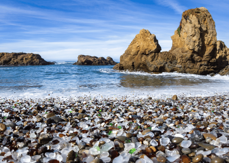Colorful glass pebbles blanket this beach in Fort Bragg, the beach was used as a garbage dump years ago, nature has tumbled the glass and polished it making it a tourist destination