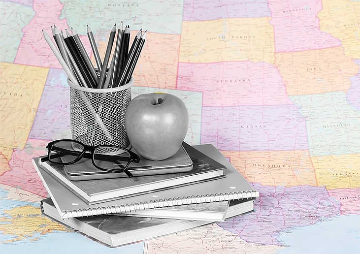 photo illustration U.S map with grayscale teaching materials placed on topced 