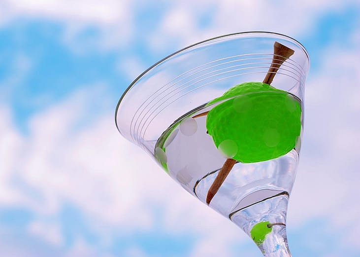 martini with golf tee and ball instead of olive 