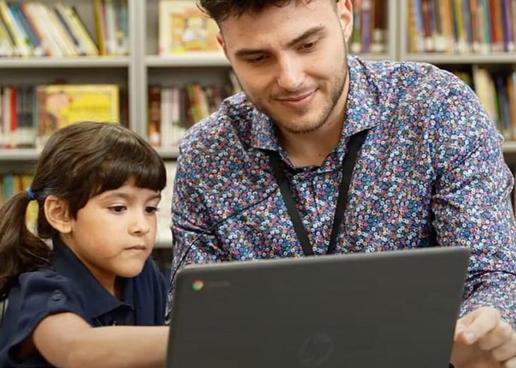 Nick Dinelaris, a Chapter One "early literacy interventionist," working with a student 
