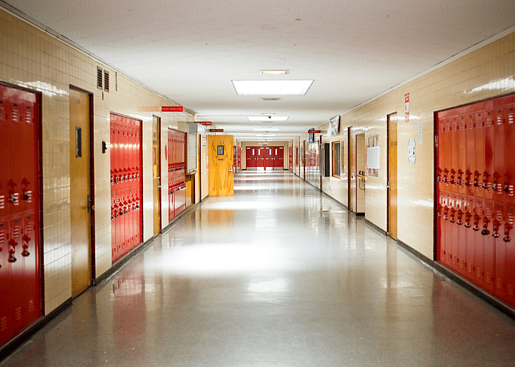 empty school hallway lined with lockers