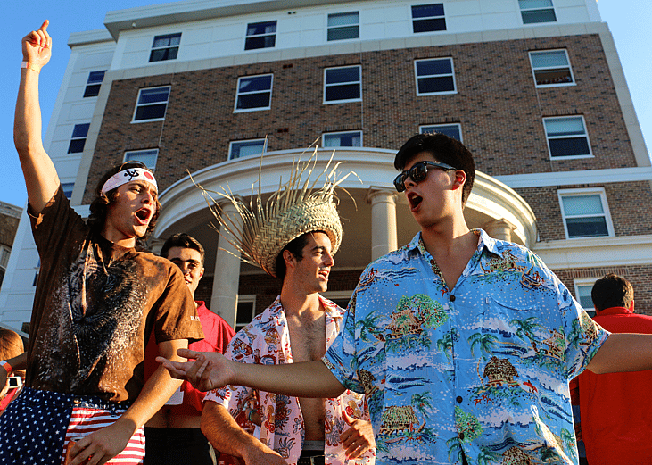 College students in Madison enjoying their game day party while having a good time on the lake. 
