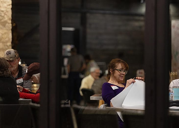 An election worker hand counts ballots inside of The Edge, a winery in Fredericksburg on Mar. 5, 2024.