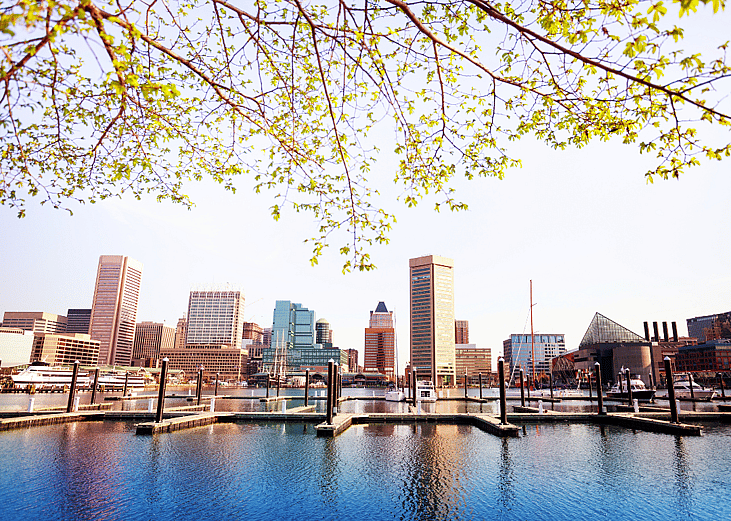 Baltimore skyline with water in the foreground.