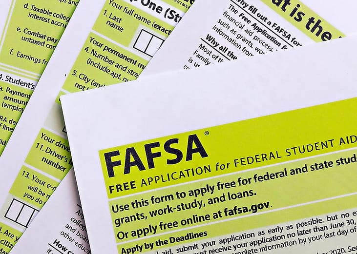 Overhead view of paper FAFSA application forms.