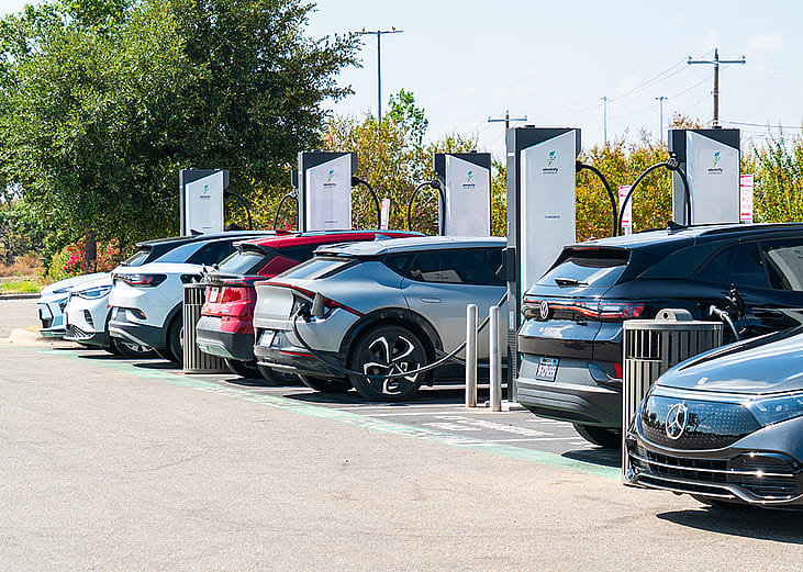 An Electrify charging station in Austin, TX where many EV cars are charging.