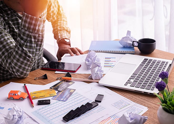 Person struggling to manage expenses.