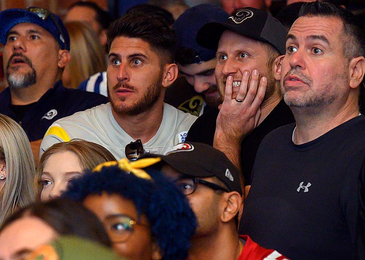 Photo of football fans watching NFC championships in a sports bar. 