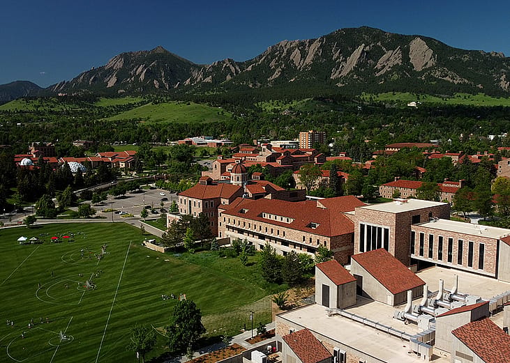 An aerial view of the landscape and campus of University of Colorado in Boulder, CO.
