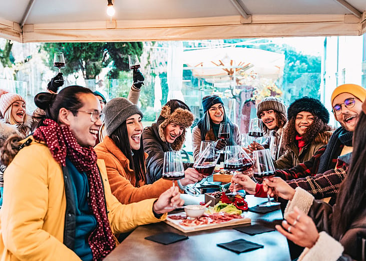 Friends eating in a restaurant in winter