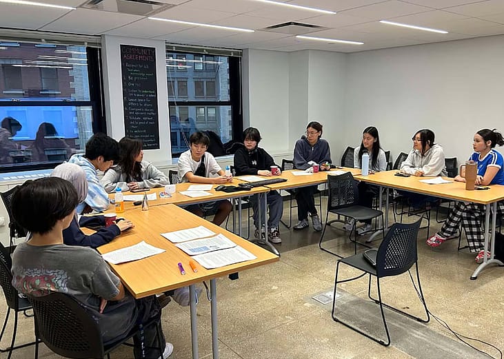 Photo showing students in the Asian American Student Advocacy Project meeting.