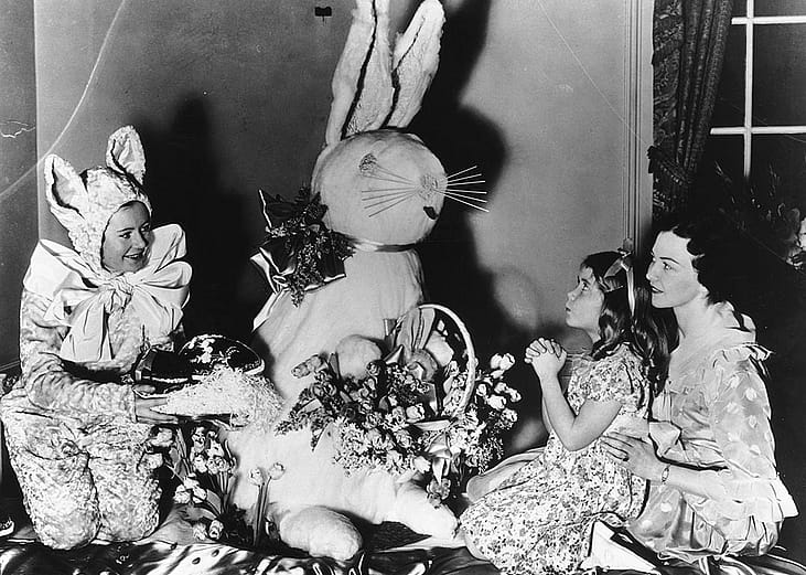 Historical photo of young girl praying to Easter Bunny in New York in 1936.