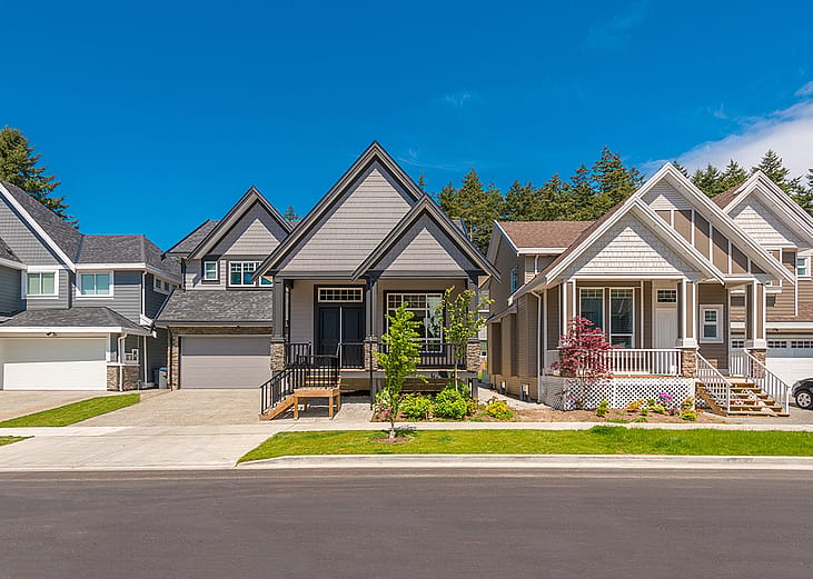 A row of contemporary modern three-bedroom homes.