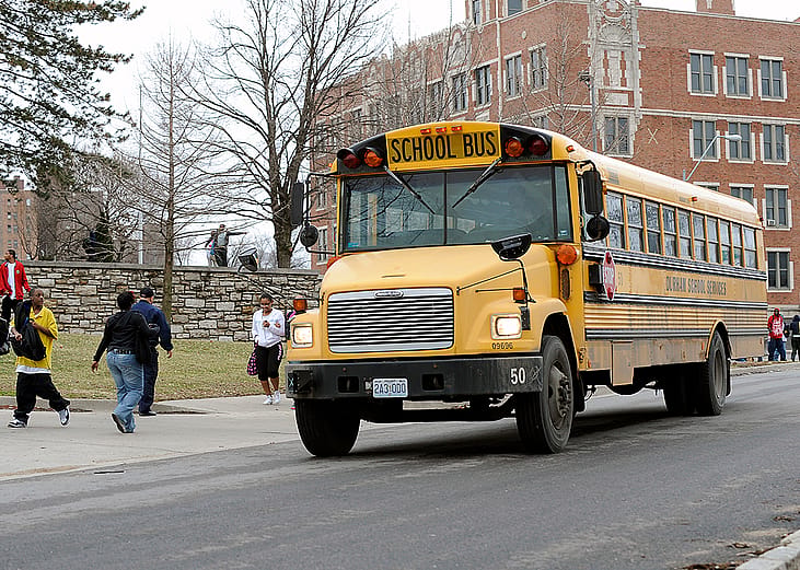 Students around a school bus in Kansas City, Missouri.