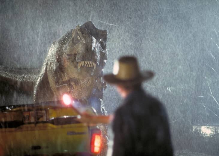 Actor Sam Neill as Dr. Alan Grant takes on a Tyrannosaurus Rex in a scene from the film 'Jurassic Park', 1993.