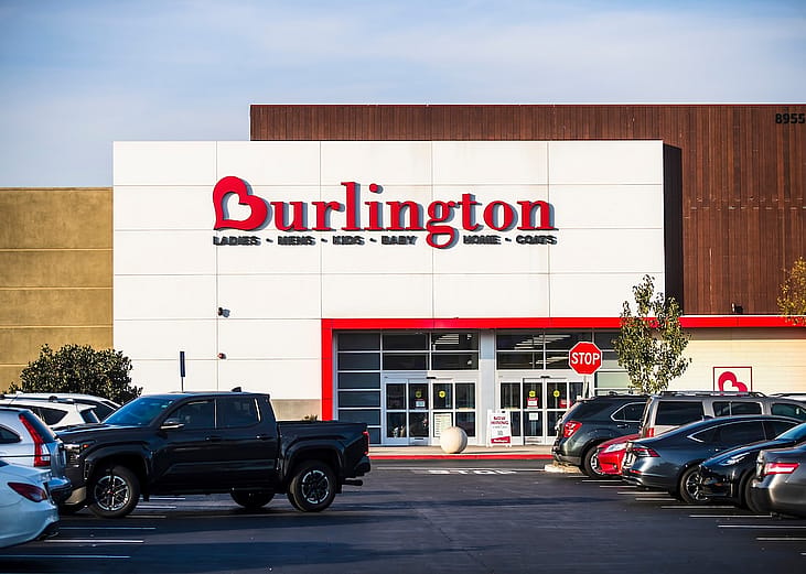 A Los Angeles Burlington retail store exterior with a parking lot in the foreground under clear skies.