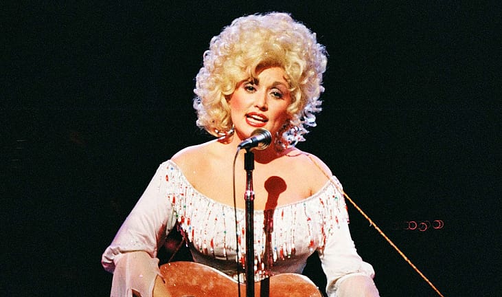 Dolly Parton performs on stage at The Dominion Theatre in 1983