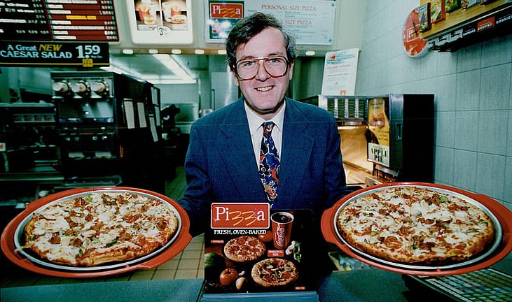McDonald's Vice-President Peter Beresford showing off McDonald's new McPizza in 1992.