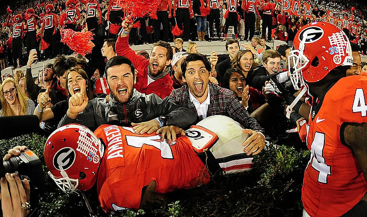 Georgia Bulldogs football player celebrates with fans after the game against the Missouri Tigers in Atlanta, Georgia.
