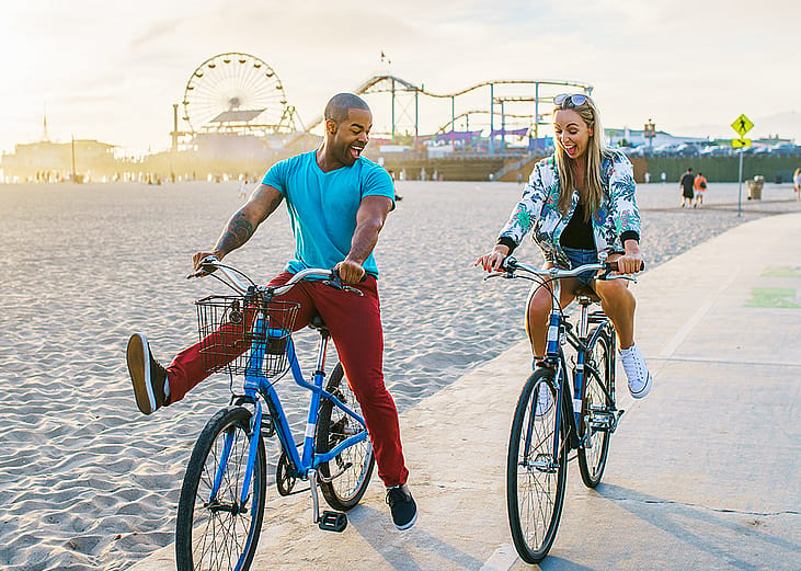 Couple riding bikes in Santa Monica.
