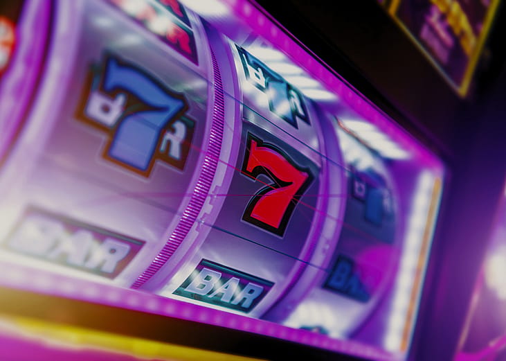 A close up of a slot machine with the number 7 on it.