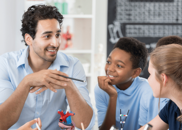 A middle school teacher with two students.