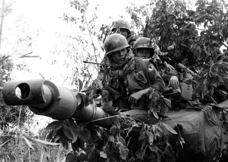 Army of the Republic of Vietnam soldiers riding on a M41 Walker Bulldog light tank, part of a convoy in Operation Lam Son.
