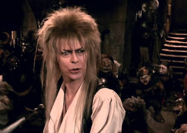 David Bowie surrounded by little creatures.