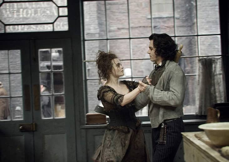Johnny Depp and Helena Bonham Carter dancing together.