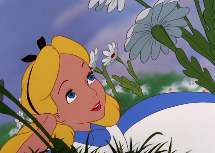 A cartoon of a little girl in the grass looking up at flowers.