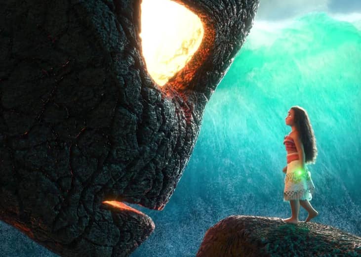 A Hawaiian girl facing a giant stone lit head.