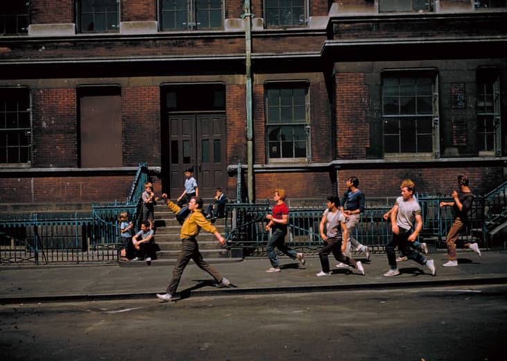 Men dancing down the street.