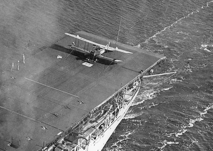 Pictured: A U.S. Navy Aeromarine 39B spotted on the aft section of the flight deck of the aircraft carrier USS Langley (CV-1) steaming near Naval Air Station Pensacola, Florida.
