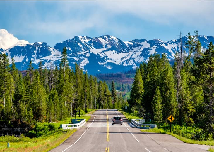 Car on national park road in Wyoming.