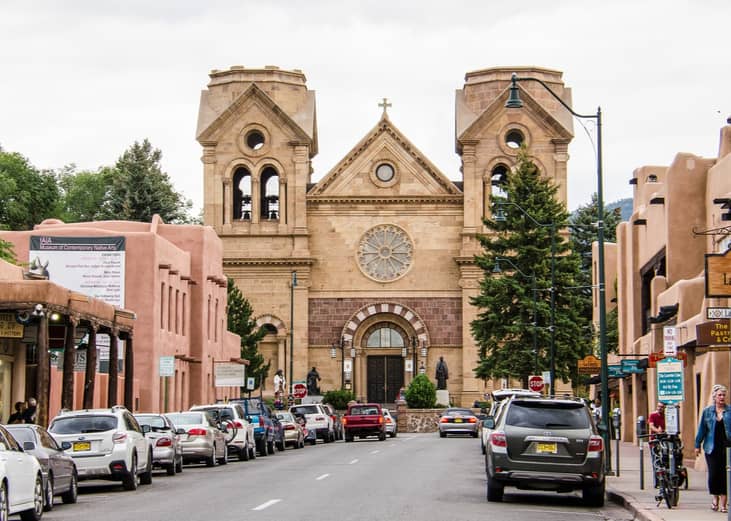 Santa Fe, New Mexico street lined with cars.