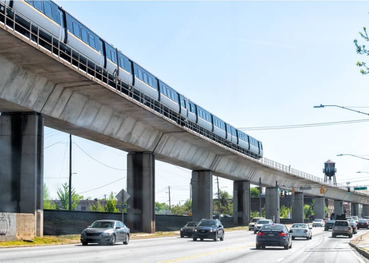 Vehicles moving on a highway below the rapid transit in Atlanta, Georgia.