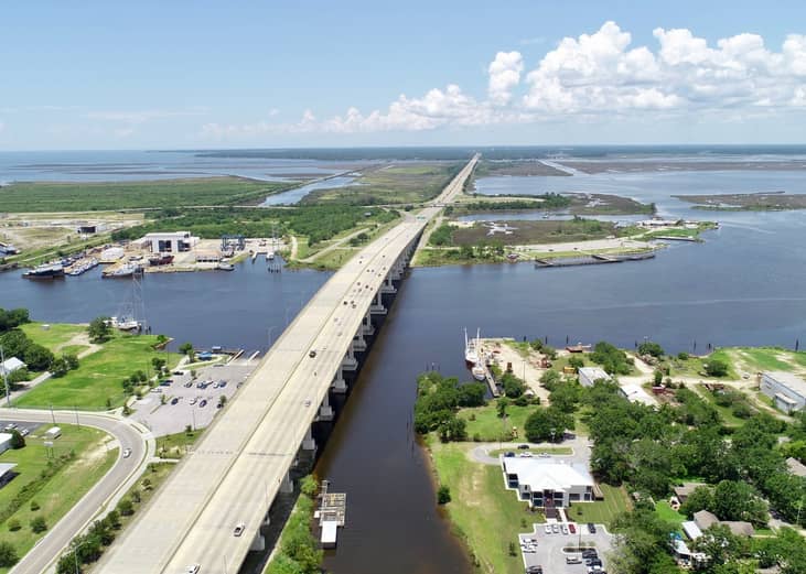 Bridge crossing large body of water in Mississippi.