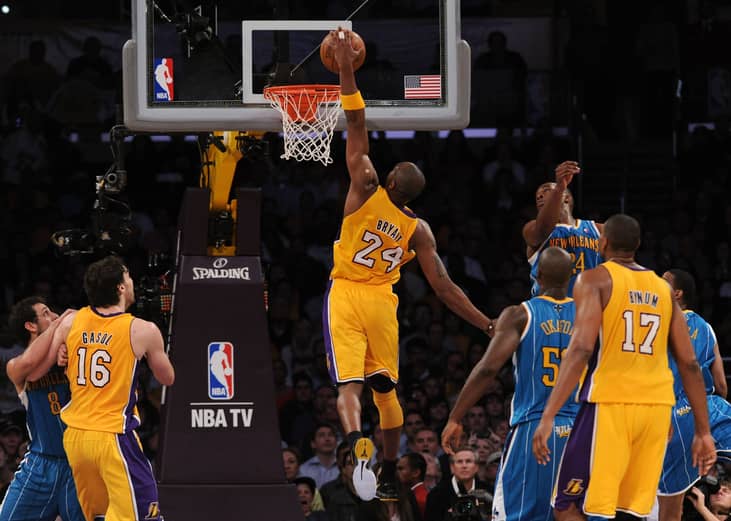 Back view of Kobe Bryant dunking the ball with his left hand