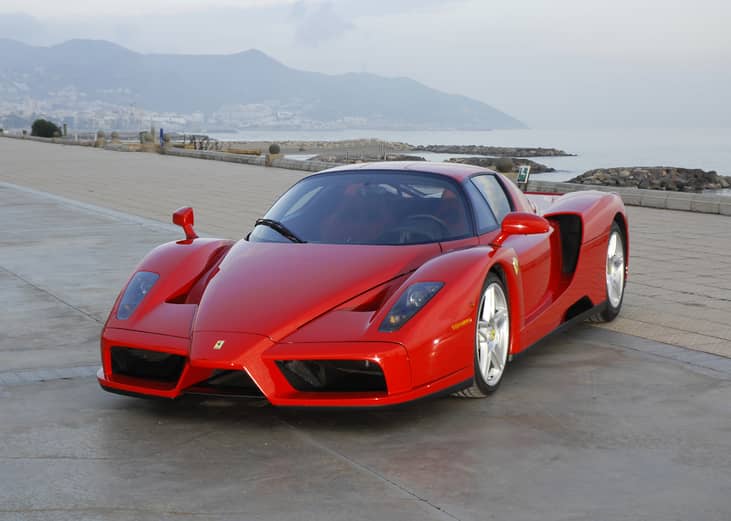 2003 Ferrari Enzo displayed outside.