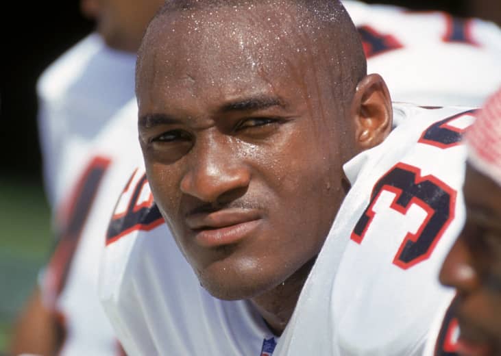 Cornerback Bruce Pickens of the Atlanta Falcons sits on the bench during a game.