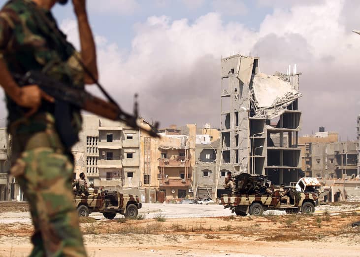 Members of the Libyan National Army patrol a street in central Benghazi