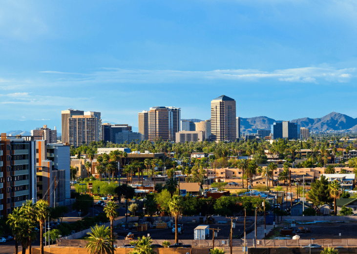 Aerial view of Scottsdale, Arizona with palm trees in the foreground.