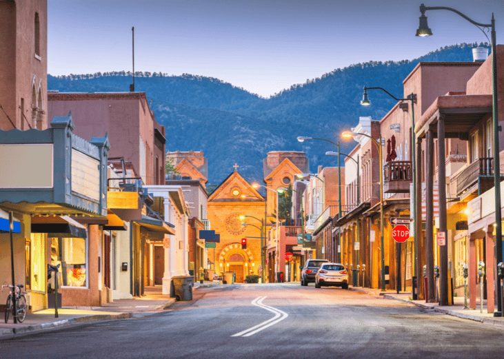 A quiet street in Santa Fe, New Mexico at dusk.