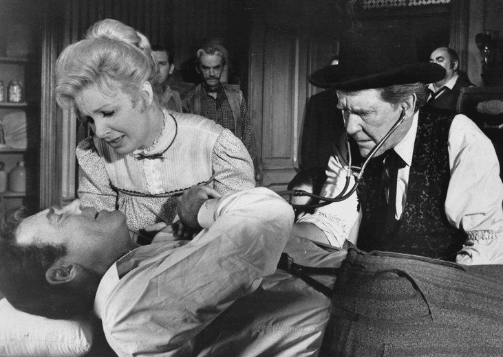 Henry Fonda, Burgess Meredith, and Joanne Woodward in a scene from "A Big Hand for the Little Lady"