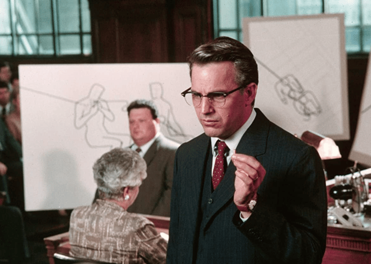 Kevin Costner and Wayne Knight in "JFK".
