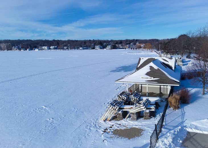 Beach house overlooks a frozen Lake Geneva.