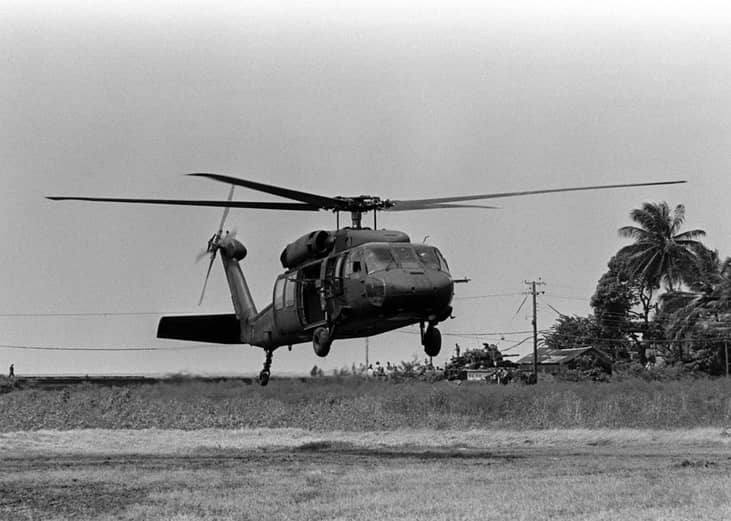 Pictured: A UH-60 Black Hawk helicopter lands at the Racetrack Landing Zone during Operation Urgent Fury