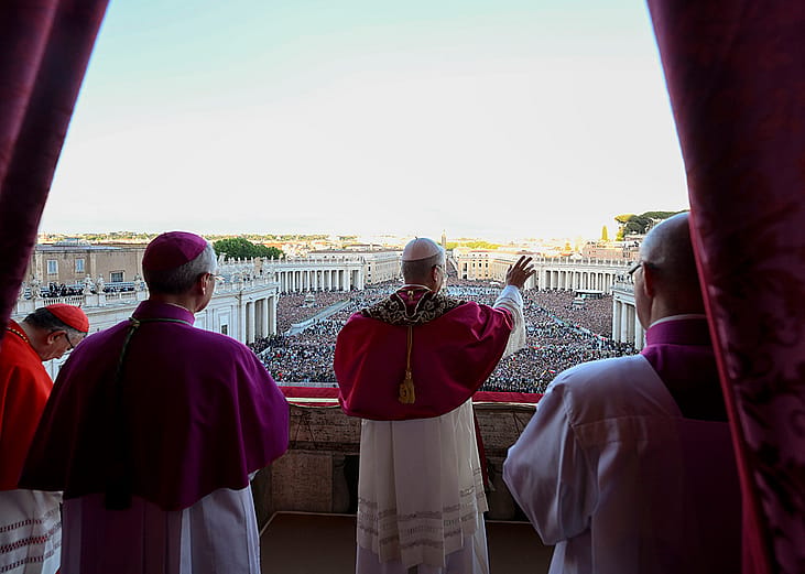 Newly elected Pope Leo XIV, Robert Prevost, waving at the crowd on the main central loggia balcony overlooking St. Peter's Square on May 08, 2025 in Vatican City, Vatican. 